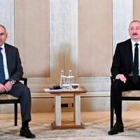 Azerbaijani President Ilham Aliyev, right, and Prime Minister of Armenia Nikol Pashinyan pose for a photo prior to their talks in Abu Dhabi, United Arab Emirates, July 10, 2025. (Azerbaijani Presidential Press Office via AP)