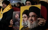 A woman holds photos of top Hezbollah commander Fouad Shukur, left, who was killed in an Israeli airstrike, Hezbollah's former leader Hassan Nasrallah, right, and his cousin and successor, Hashem Safieddine, center, during a commemoration marking the first anniversary of Shukur's death in Dahiyeh, a southern suburb of Beirut, Lebanon, July 30, 2025. (AP Photo/Bilal Hussein)