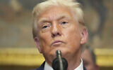US President Donald Trump listens during an event to sign an executive order restarting the Presidential Fitness Test in public schools, Thursday, July 31, 2025, in the Roosevelt Room of the White House in Washington. (AP Photo/Jacquelyn Martin)