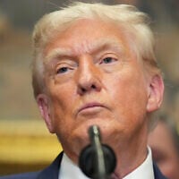 US President Donald Trump listens during an event to sign an executive order restarting the Presidential Fitness Test in public schools, Thursday, July 31, 2025, in the Roosevelt Room of the White House in Washington. (AP Photo/Jacquelyn Martin)