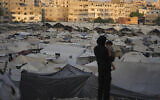 A tent camp for displaced Palestinians stretches along Gaza City, August 3, 2025. (AP Photo/ Jehad Alshrafi)