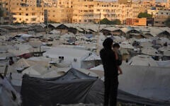 A tent camp for displaced Palestinians stretches along Gaza City, August 3, 2025. (AP/Jehad Alshrafi)