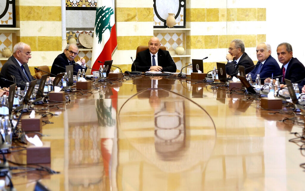 Lebanese president Joseph Aoun, center, and Lebanese Prime Minister Nawaf Salam, left background, lead a Cabinet meeting to discuss the disarmament of Hezbollah, at the presidential palace in Baabda, east of Beirut, Lebanon, August 5, 2025. (Lebanese Presidency press office via AP)