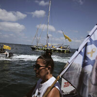 Relatives of Israeli hostages held by Hamas sail along the coast of Ashkelon on Thursday, August 7, 2025. (AP/Leo Correa)
