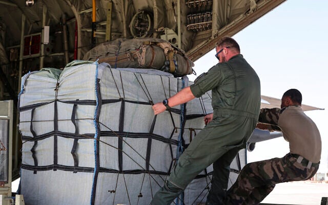 Members of the French Air Force load the C-130 plane with humanitarian aid containers which will be airdropped to Palestinians in the Gaza Strip, August 8, 2025. (AP Photo/Raad Adayleh) Members of the French Air Force load the C-130 plane with humanitarian aid containers which will be airdropped to Palestinians in the Gaza Strip, August 8, 2025. (AP Photo/Raad Adayleh)