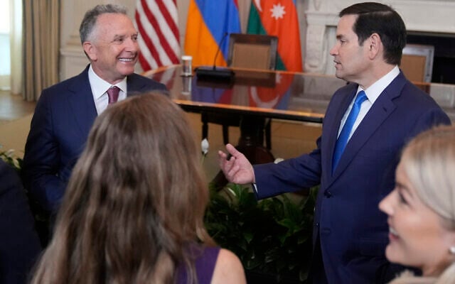 Special Presidential Envoy Steve Witkoff, left, and US Secretary of State Marco Rubio arrive before a trilateral signing ceremony with Azerbaijan's President Ilham Aliyev and Armenia's Prime Minister Nikol Pashinyan in the State Dining Room of the White House, Friday, Aug. 8, 2025, in Washington. (AP Photo/Mark Schiefelbein)