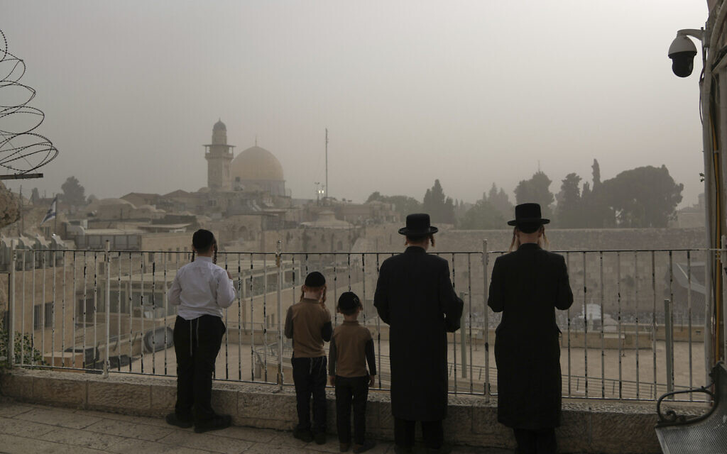 Ultra-Orthodox Jews overlook the Western Wall in Jerusalem's Old City on August 11, 2025. (AP/Mahmoud Illean) Ultra-Orthodox Jews overlook the Western Wall in Jerusalem's Old City on August 11, 2025. (AP/Mahmoud Illean)
