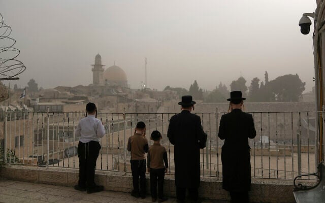 Ultra-Orthodox Jews overlook the Western Wall in Jerusalem's Old City on August 11, 2025. (AP/Mahmoud Illean) Ultra-Orthodox Jews overlook the Western Wall in Jerusalem's Old City on August 11, 2025. (AP/Mahmoud Illean)