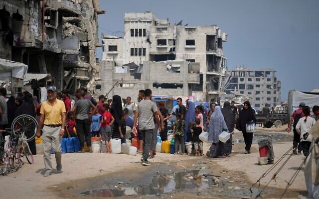 Palestinians line up to collect water from a distribution point in Gaza City during a heatwave, August 12, 2025. (AP Photo/Jehad Alshrafi) Palestinians line up to collect water from a distribution point in Gaza City during a heatwave, August 12, 2025. (AP Photo/Jehad Alshrafi)