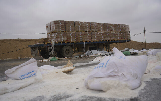 Damaged humanitarian aid for Gaza seen scattered on the ground next to the Kissufim crossing in southern Israel, Wednesday, August 13, 2025. (AP/Ariel Schalit)