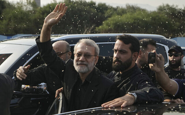 Ali Larijani, center, head of Iran's National Security Council, gestures as Hezbollah supporters throw rice to welcome him outside Rafik Hariri International Airport in Beirut, Lebanon, August 13, 2025. (AP/Bilal Hussein)