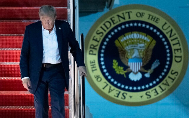 US President Donald Trump disembarks Air Force One as he arrives at Joint Base Andrews, Maryland, August 16, 2025, from a summit with Russian President Vladimir Putin in Anchorage, Alaska. (AP Photo/Manuel Balce Ceneta)