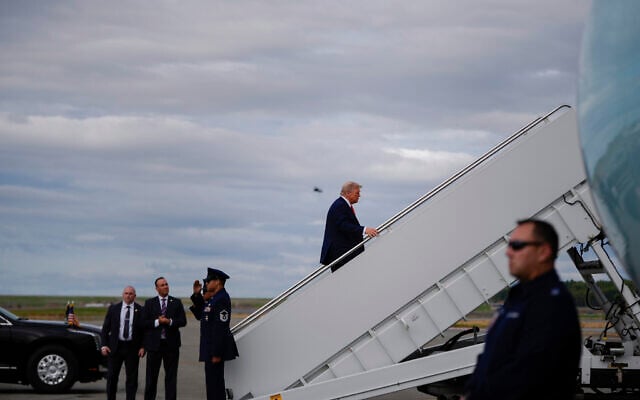 US President Donald Trump boards Air Force one at Joint Base Elmendorf- Richardson following a meeting with Russia's President Vladimir Putin, Friday, Aug. 15, 2025, in Anchorage, Alaska. (AP Photo/Julia Demaree Nikhinson)