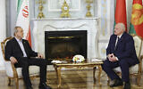 In this photo, released by Belarusian Presidential Press Service, Belarusian President Alexander Lukashenko, right, and Iranian President Masoud Pezeshkian talk to each other during their meeting in Minsk, Belarus, August 20, 2025. (Belarusian Presidential Press Service via AP)
