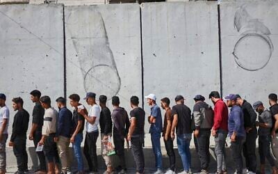 Young Kurdish men line up to sign up to join Syrian government's General Security forces at a police station in Afrin, Syria, an area in the country's north from which Kurds were forcibly displaced years ago, Aug. 21, 2025. (AP Photo/Omar Albam)