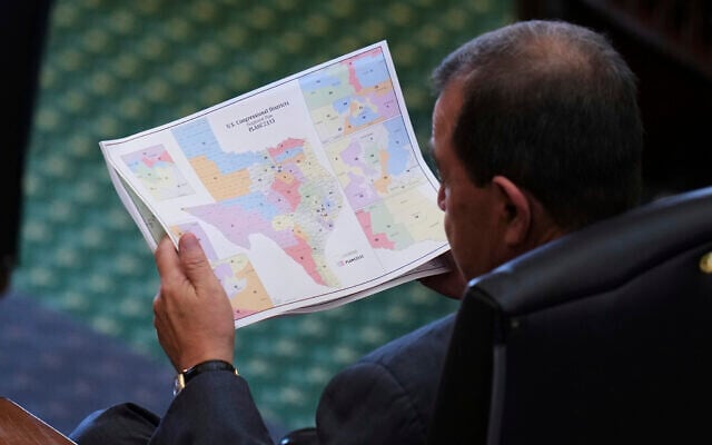 Texas state Sen. Pete Flores looks over a redrawn US congressional map during debate over a bill in the Senate Chamber at the Texas Capitol in Austin, Texas, Aug. 22, 2025. (AP Photo/Eric Gay) Texas state Sen. Pete Flores looks over a redrawn US congressional map during debate over a bill in the Senate Chamber at the Texas Capitol in Austin, Texas, Aug. 22, 2025. (AP Photo/Eric Gay)
