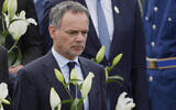 FILE - Netherlands' Foreign Minister Caspar Veldkamp lays flowers during a wreath laying ceremony on the 30th anniversary of Srebrenica massacre at the Memorial Center in Potocari, Bosnia, July 11, 2025. (AP Photo/Darko Bandic, File)