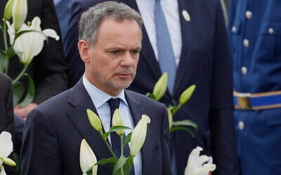 FILE - Netherlands' Foreign Minister Caspar Veldkamp lays flowers during a wreath laying ceremony on the 30th anniversary of Srebrenica massacre at the Memorial Center in Potocari, Bosnia, July 11, 2025. (AP Photo/Darko Bandic, File)