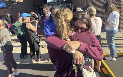 Parents await news of their children after a mass shooting at Annunciation Church on August 27, 2025, in Minneapolis, Minnesota. (Richard Tsong-Taatarii/Star Tribune via AP)