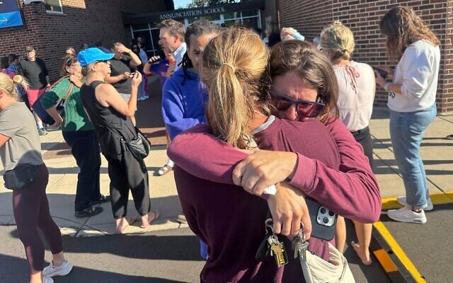 Parents await news of their children after a mass shooting at Annunciation Church on August 27, 2025, in Minneapolis, Minnesota. (Richard Tsong-Taatarii/Star Tribune via AP) Parents await news of their children after a mass shooting at Annunciation Church on August 27, 2025, in Minneapolis, Minnesota. (Richard Tsong-Taatarii/Star Tribune via AP)