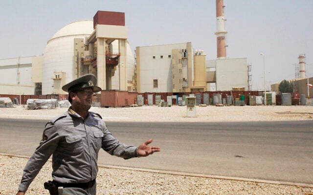 In this Aug. 21, 2010 file photo, an Iranian security officer directs media at the Bushehr nuclear power plant, with the reactor building seen in the background, just outside the southern city of Bushehr, Iran. (AP Photo/Vahid Salemi, File) In this Aug. 21, 2010 file photo, an Iranian security officer directs media at the Bushehr nuclear power plant, with the reactor building seen in the background, just outside the southern city of Bushehr, Iran. (AP Photo/Vahid Salemi, File)
