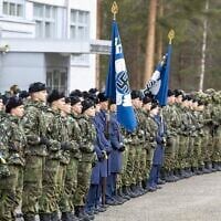 FILE - Flags of the Finnish Air Forces, featuring swastikas, are seen during a parade in Jyvaskyla, Finland in November 2024. (Tommi Anttonen/Lehtikuva via AP, File)