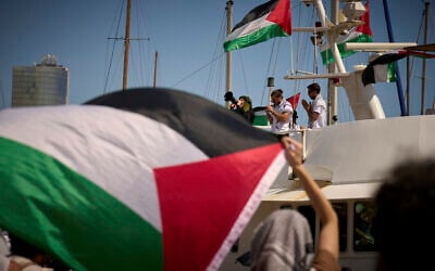Demonstrators shout slogans on a boat ahead of the launch of a civilian flotilla bound for Gaza, aiming to break the Israeli blockade and deliver humanitarian aid, in Barcelona, Spain, Aug. 31, 2025. (AP/Emilio Morenatti) Demonstrators shout slogans on a boat ahead of the launch of a civilian flotilla bound for Gaza, aiming to break the Israeli blockade and deliver humanitarian aid, in Barcelona, Spain, Aug. 31, 2025. (AP/Emilio Morenatti)