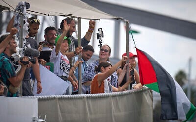 Swedish climate activist Greta Thunberg, center left, waves from a boat taking part in a civilian flotilla bound for Gaza, aiming to break the Israeli blockade on the Strip, in Barcelona, Spain, August 31, 2025. (AP Photo/Emilio Morenatti) Swedish climate activist Greta Thunberg, center left, waves from a boat taking part in a civilian flotilla bound for Gaza, aiming to break the Israeli blockade on the Strip, in Barcelona, Spain, August 31, 2025. (AP Photo/Emilio Morenatti)