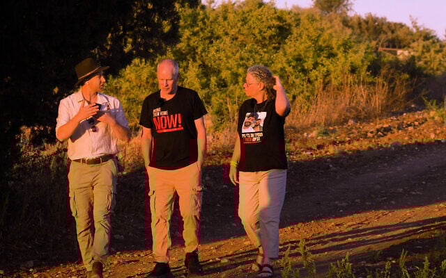 Filmmaker Eli Katzoff and released hostages Keith and Aviva Siegel on the northern border for 'Through the Land,' a new drone-shot webseries produced in cooperation with The Times of Israel. (courtesy)