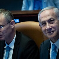 Prime Minister Benjamin Netanyahu and Justice Minister Yariv Levin attend a special session of Knesset in honor of Argentinian President Javier Milei, June 11, 2025. (Yonatan Sindel/Flash90)