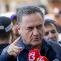 Defense Minister Israel Katz speaks to press at the site of a missile impact in Holon on June 19, 2025. (Chaim Goldberg/FLASH90)