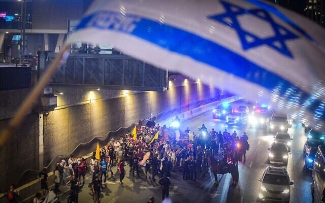 Activists block the Ayalon Highway in Tel Aviv, during a protest calling for the release of hostages held in the Gaza Strip and against the government, August 5, 2025. (Avshalom Sassoni/Flash90)