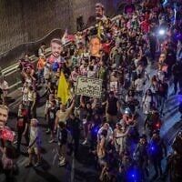 Activists block the Ayalon Highway in Tel Aviv, during a protest calling for the release of hostages held in the Gaza Strip and against the government, August 5, 2025. (Avshalom Sassoni/Flash90)