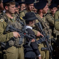 Ultra-Orthodox soldiers from the Hasmonean Brigade take part in a ceremony, after completing seven months of basic and advanced training, at the Western Wall in Jerusalem's Old City on August 6, 2025. (Chaim Goldberg/Flash90)