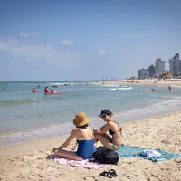 Enjoying the beach in Tel Aviv on a hot summer day. August 6, 2025. (Miriam Alster/FLASH90)