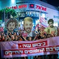 Protesters hold a banner reading: "Occupation of Gaza endangers hostages and soldiers" at a demonstration in Tel Aviv, August 7, 2025. (Erik Marmor/Flash90)