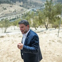 Finance Bezalel Smotrich attends a press conference announcing his plans to approve more than 3,000 housing units in the  E1 settlement project between Jerusalem and Ma’ale Adumim, August 14, 2025.(Yonatan Sindel/Flash90)