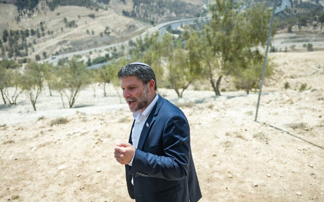 Finance Bezalel Smotrich attends a press conference announcing his plans to approve more than 3,000 housing units in the  E1 settlement project between Jerusalem and Ma’ale Adumim, August 14, 2025.(Yonatan Sindel/Flash90)