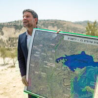 Finance Minister Bezalel Smotrich attends a press conference announcing his plans to approve more than 3,000 housing units in the  E1 settlement project between Jerusalem and Ma’ale Adumim on August 14, 2025. (Yonatan Sindel/Flash90)