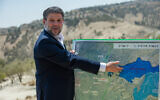 Finance Minister Bezalel Smotrich attends a press conference announcing his plans to approve more than 3,000 housing units in the E1 West Bank settlement project between Jerusalem and Ma’ale Adumim on August 14, 2025. (Yonatan Sindel/Flash90)