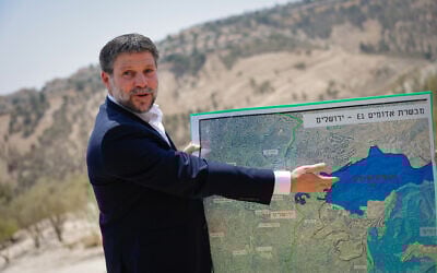 Finance Minister Bezalel Smotrich at a press conference announcing his plans to approve more than 3,000 housing units in the  E1 settlement project between Jerusalem and Ma'ale Adumim on August 14, 2025. (Yonatan Sindel/FLASH90)