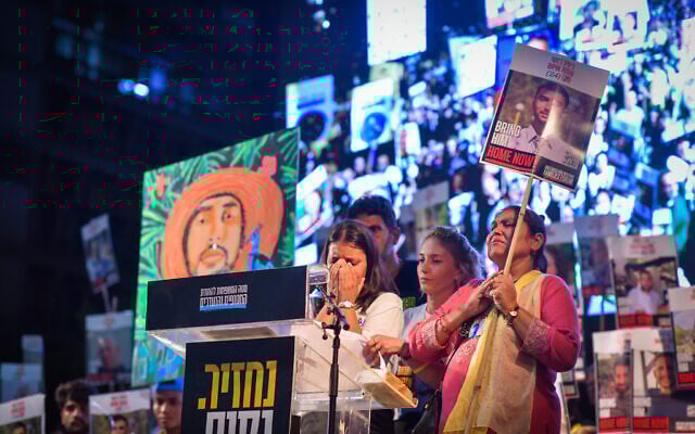 Protesters listen to a speak at Hostages Square in Tel Aviv, calling for a deal with the Hamas terror group to secure the release of hostages held in Gaza, on August 16, 2025. (Avshalom Sassoni/Flash90)