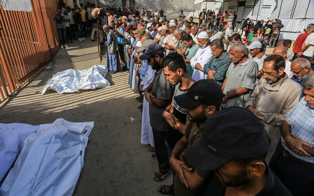 A crowd mourns the deaths of Palestinians killed in an Israeli airstrike outside the Nasser Hospital in Khan Younis, in the southern Gaza Strip, on August 19, 2025. (Abed Rahim Khatib/Flash90)