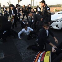Ultra-Orthodox protesters against the jailing of yeshiva students who failed to comply with an army recruitment order, outside the military prison in Beit Lid, near Kfar Yona, August 20, 2025. (Gili Yaari /Flash90)
