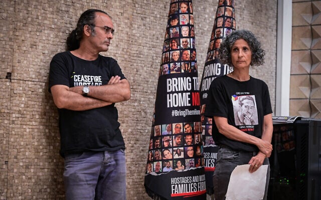Yehuda Cohen, left and his wife Viki Cohen at a press conference calling for the release of their son Nimrod Cohen  in Tel Aviv on August 25, 2025. (Avshalom Sassoni/Flash90)
