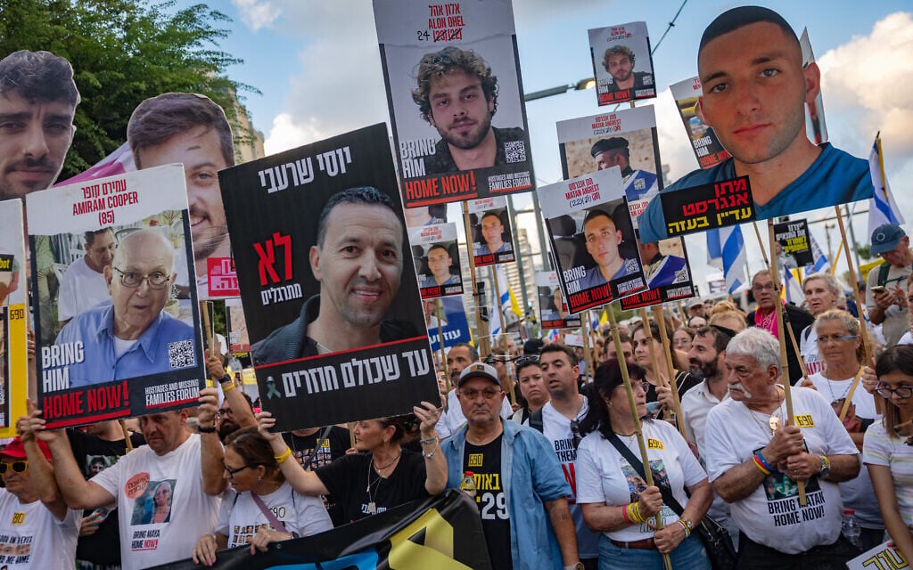Protesters march to Tel Aviv's Hostages Square for a rally calling for a deal securing the release of hostages held in Gaza on August 26, 2025. (Chaim Goldberg/Flash90)