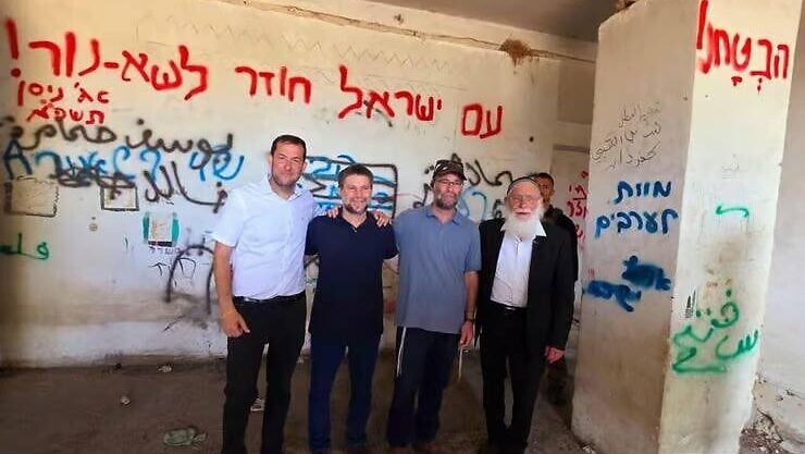 NextImg:Smotrich photographed next to ‘Death to Arabs’ graffiti, disavows message