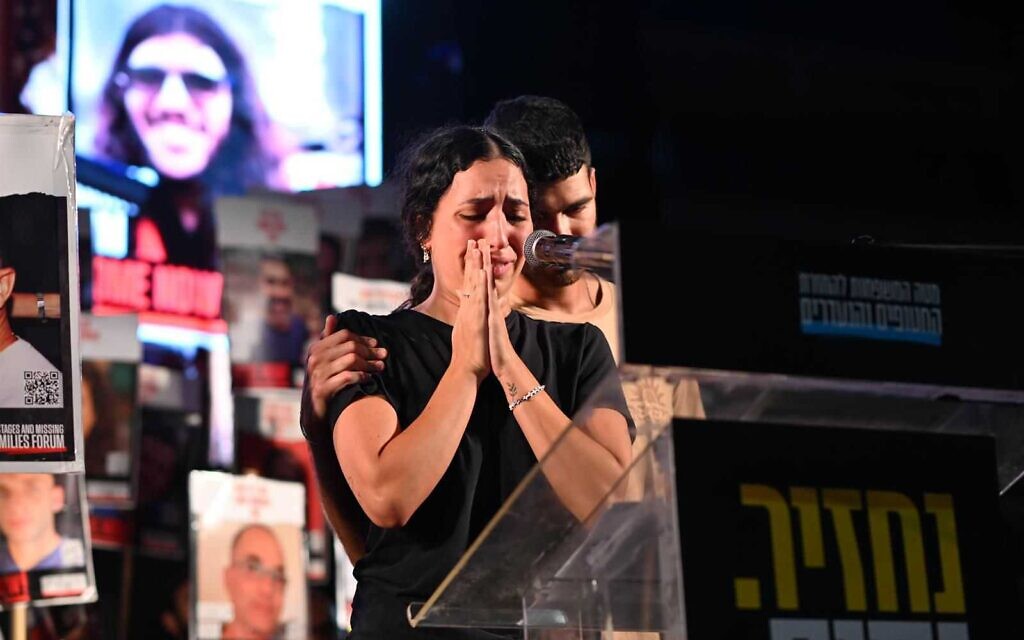Yeela David, left, and Ilay David, respectively the sister and brother of hostage Evyatar David, speak at Hostages Square, Tel Aviv, August 2, 2025. (Lior Rothstein/Hostages and Missing Families Forum)