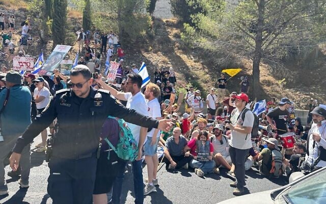 Protesters block Jerusalem's Begin Boulevard as part of a nationwide strike for the release of the hostages in Gaza on August 17, 2025. (Charlie Summers/Times of Israel)