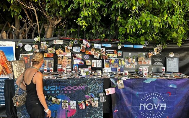 A stand commemorating the victims of the October 7, 2023, Hamas massacre at the Nova rave, at an annual Nova Healing Concert in TEl Aviv on August 14, 2025. (Stav Levaton/Times of Israel)